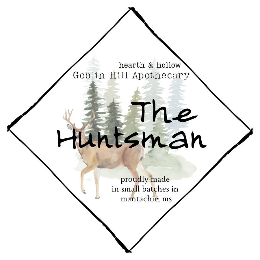 Logo for 'The Huntsman' from Goblin Hill Apothecary with a deer and trees design.