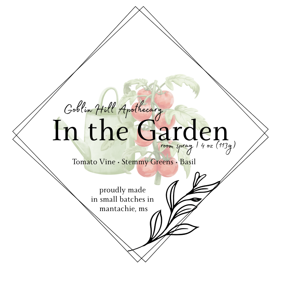 Label for Goblin Hill Apothecary's 'In the Garden' room spray with botanical design and text.