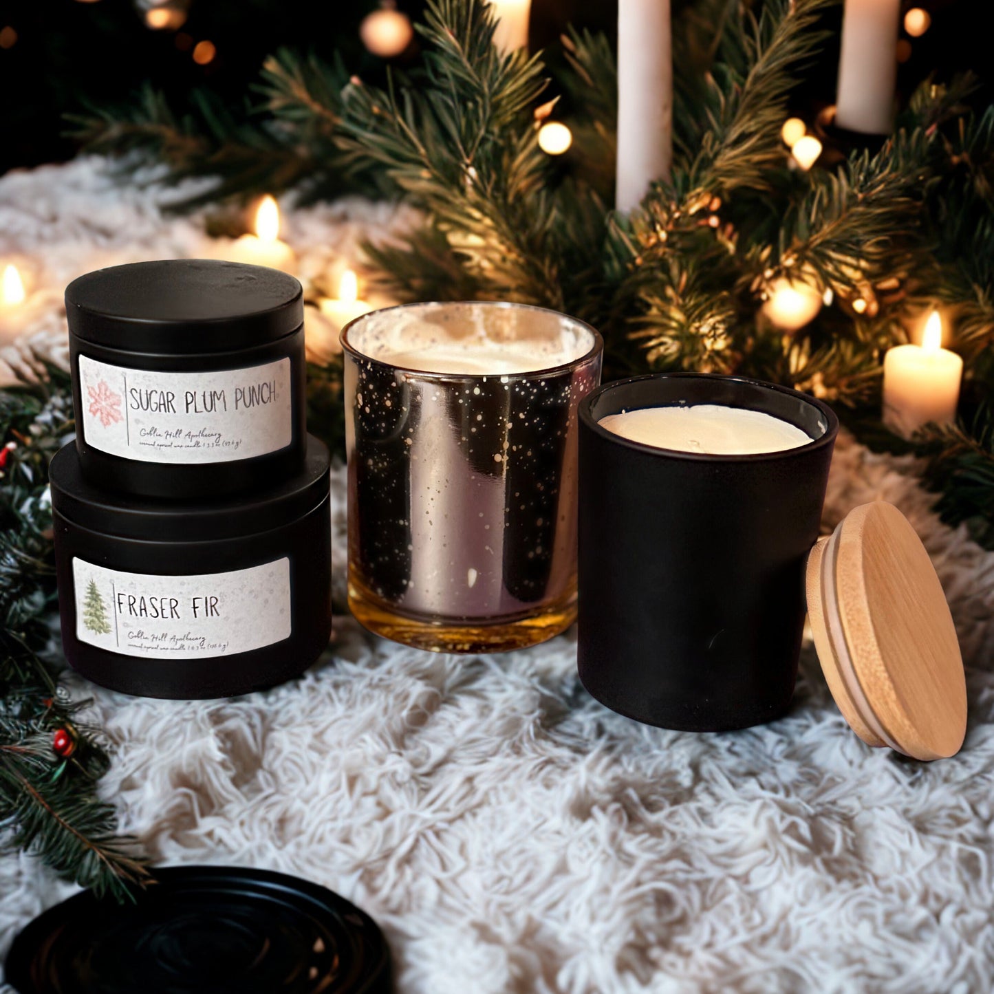 Collection of candles with Christmas decorations on a textured surface