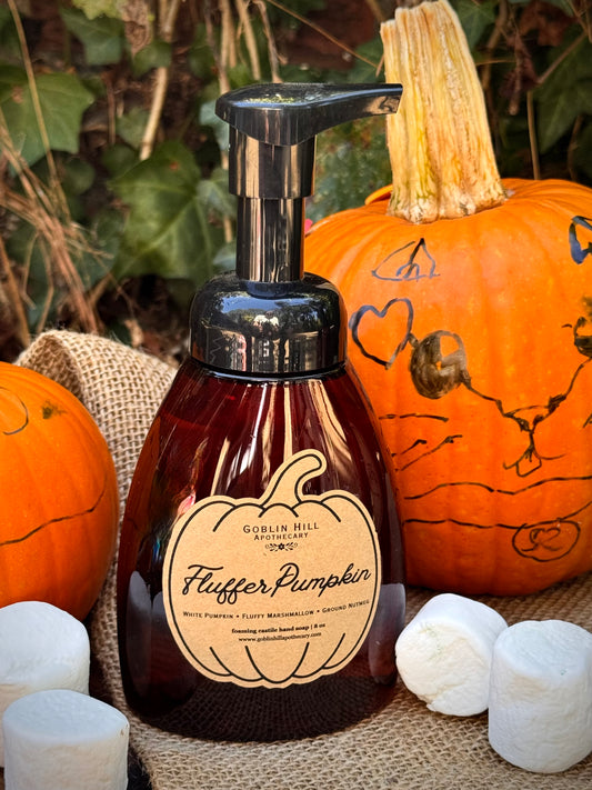 amber foaming soap bottle surrounded by pumpkins and marshmallows
