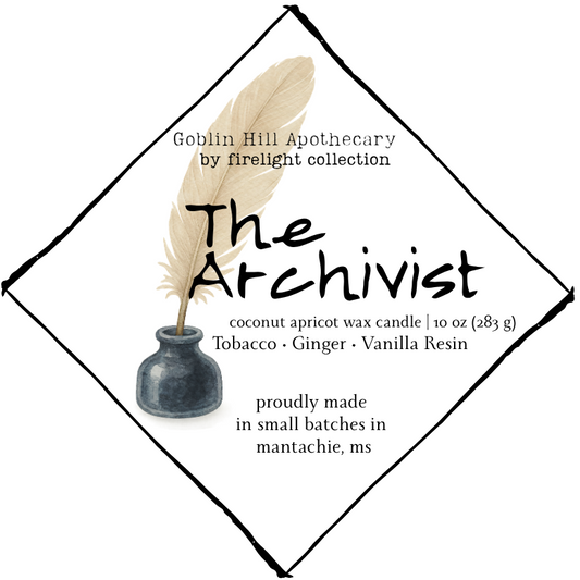 Label for 'The Archivist' candle from Goblin Hill Apothecary with a feather and small vase design.