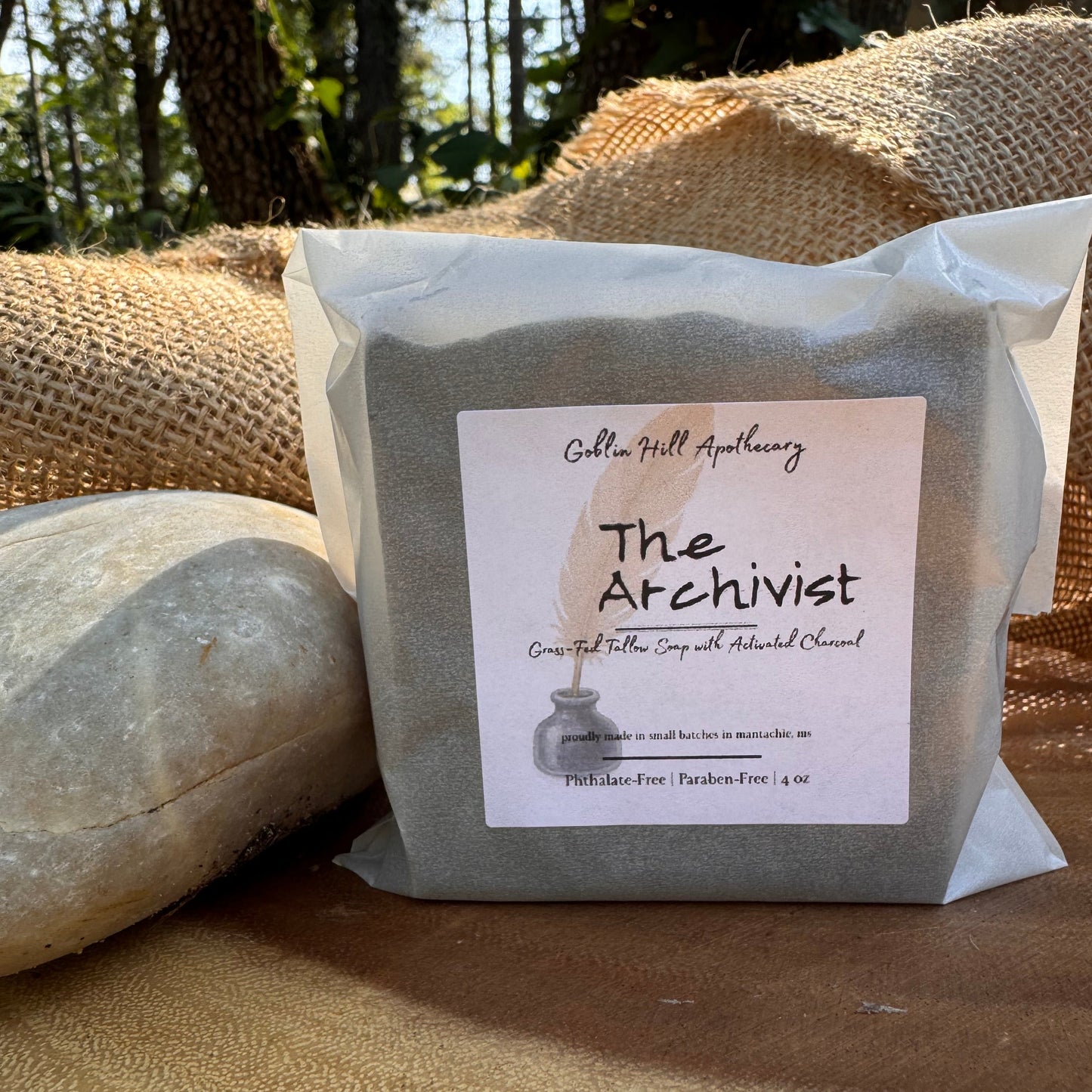 Bar of soap with 'The Archivist' label on a textured surface