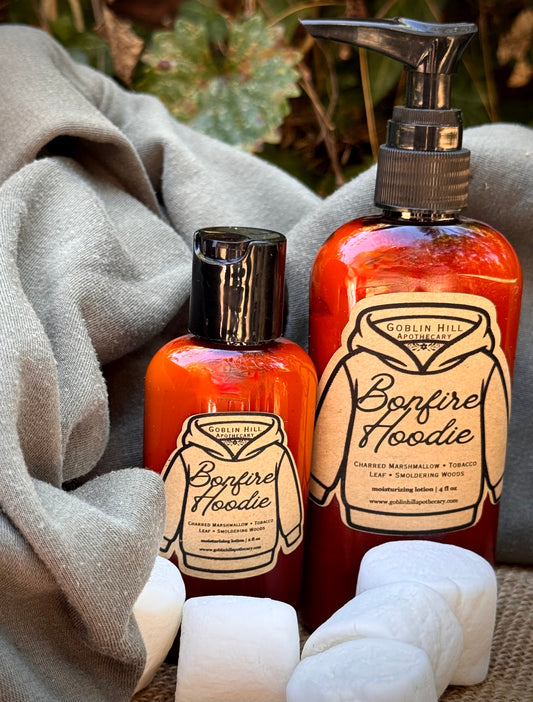 two amber bottles of bonfire hoodie lotion