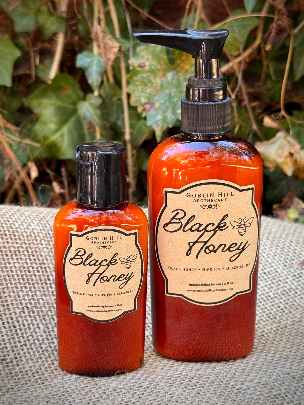 two amber lotion pump bottles