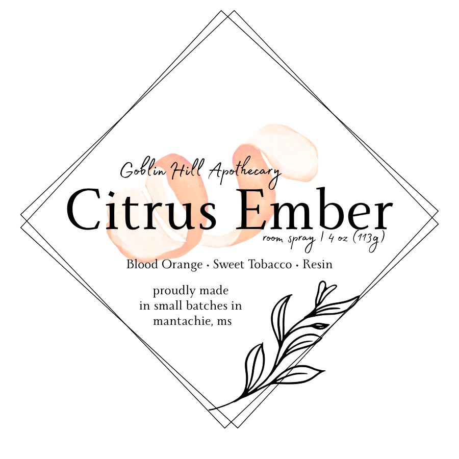 Label for Goblin Hill Apothecary Citrus Ember room spray with floral design elements.